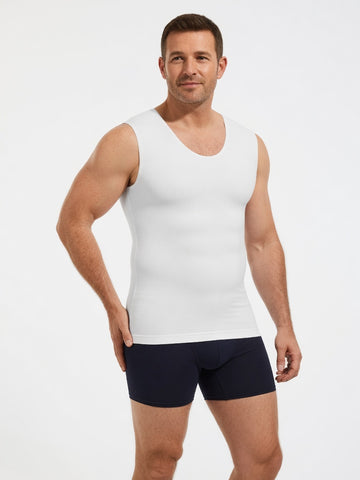 A man modeling a white sleeveless tank top paired with dark navy boxer briefs, photographed against a clean white studio background.